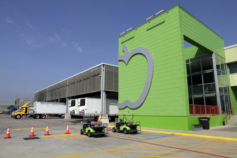 The main client entrance and loading docks of the Houston Food Bank are seen Wednesday, Oct. 14, 2020, in Houston. Distributions by the Houston Food Bank now average about 800,000 pounds (363,000 kilograms) daily after reaching the unprecedented 1 million pound mark for the first time in the spring, a level that the organization still delivers periodically. Before the coronavirus struck, the group's average daily distribution was 450,000 pounds (184,000 kilograms), said Houston Food Bank President Brian Greene. (AP Photo/Michael Wyke)