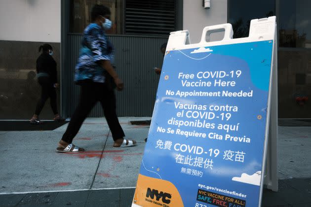 A city-operated mobile pharmacy advertises the COVID-19 vaccine in New York's Brooklyn neighborhood on July 30. Mayor Bill de Blasio has announced that the city will require all city workers to be vaccinated or tested weekly for COVID-19 and the city will now pay any individual $100 to get the shot.  (Photo: Spencer Platt via Getty Images)