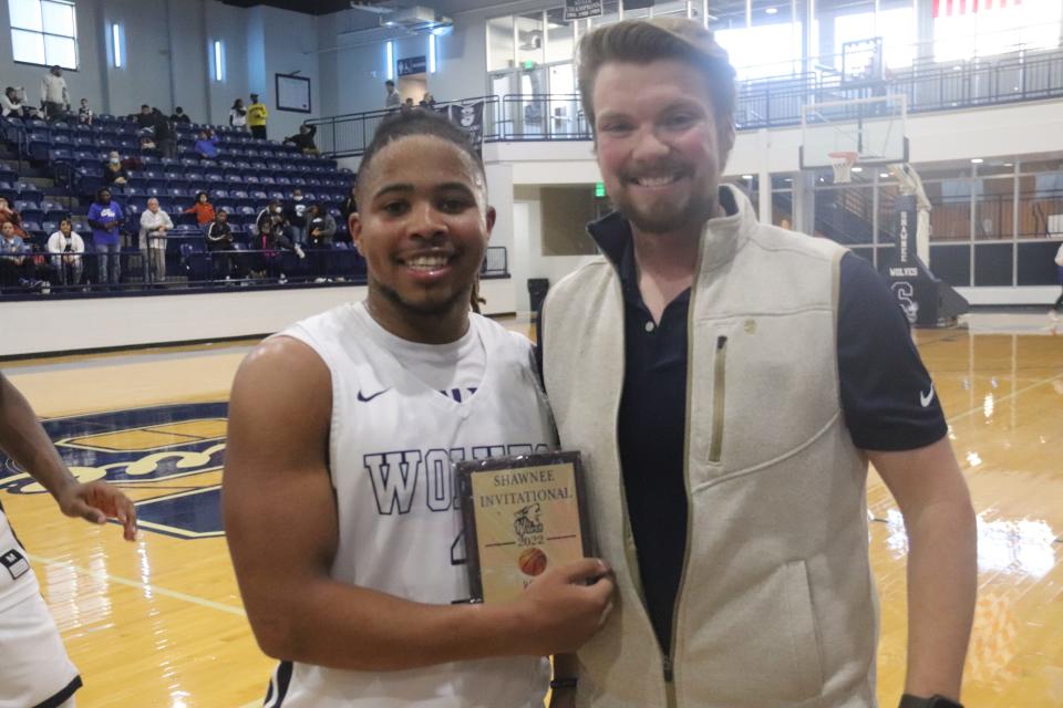 Shawnee's Jaylon Orange (left) receives a plaque from Ryan Boren after making the Shawnee Invitational All-Tournament Team on Saturday.