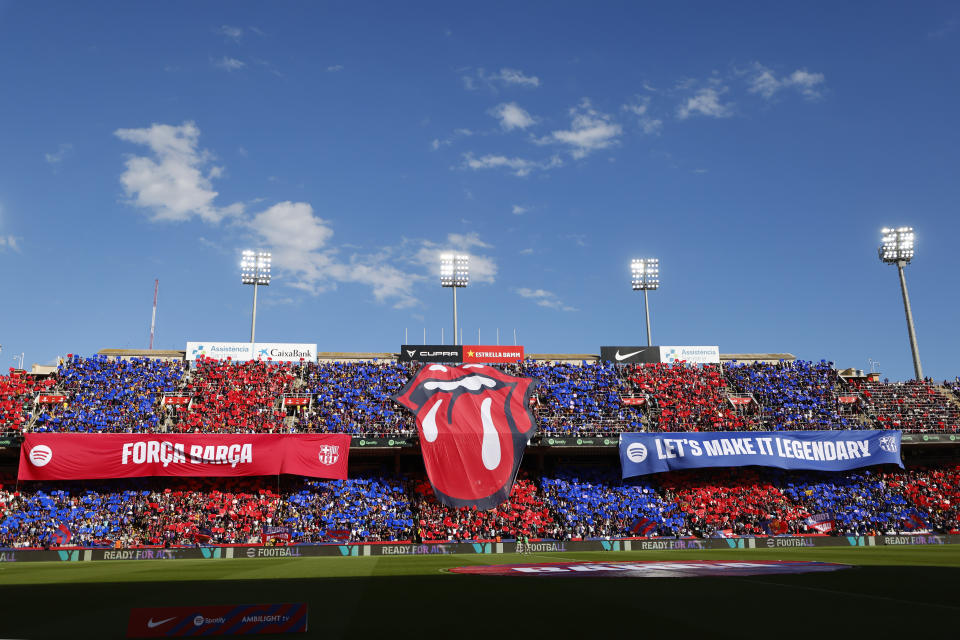 A big logo of the English rock band Rolling Stones unfolded on the stands during the La Liga soccer match between Barcelona and Real Madrid at the Olympic Stadium in Barcelona, Spain, Saturday, Oct. 28, 2023. (AP Photo/Joan Monfort)