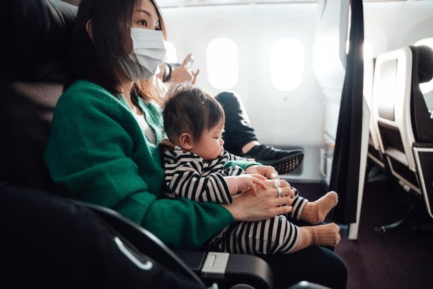 Not sure what type of flight you should take if you're traveling with a young child? Here are some questions to ask yourself before you book a nonstop or connecting flight. (Photo: Oscar Wong via Getty Images)