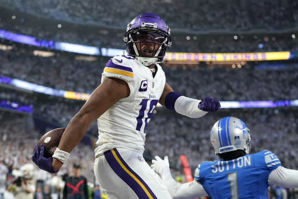 Minnesota Vikings wide receiver Justin Jefferson (18) celebrates in front of Detroit Lions cornerback Cameron Sutton (1) after catching a 26-yard touchdown pass during the first half of an NFL football game, Sunday, Dec. 24, 2023, in Minneapolis. (AP Photo/Abbie Parr)