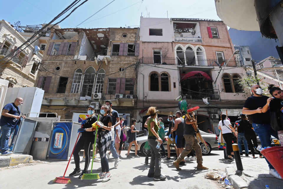Image: Volunteers clear the rubble in the Gemmayzeh neighborhood of Beirut (AFP - Getty Images)