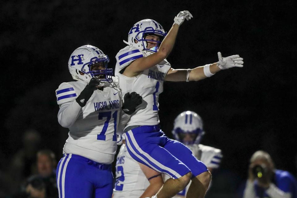Highlands wide receiver Charlie Noon (1) reacts after scoring a touchdown with offensive lineman Evan Johnson (71) in the first half against Covington Catholic Friday.