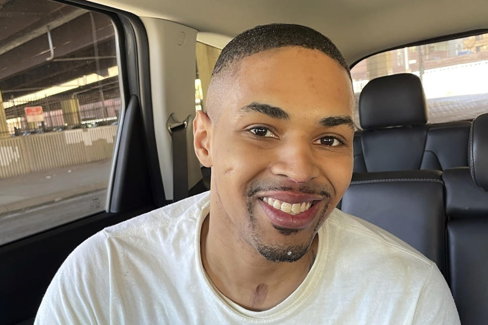 In this image provided by the Maryland Office of the Public Defender, Keith Davis Jr., 31, smiles in a vehicle following his released from prison Friday, Jan 13, 2023, in Baltimore, after prosecutors dropped all charges against him. Davis was tried for the same murder four times and was awaiting a potential fifth trial when newly elected State's Attorney Ivan Bates announced his decision to dismiss the case. (Deborah Katz Levi/Maryland Office of the Public Defender via AP)