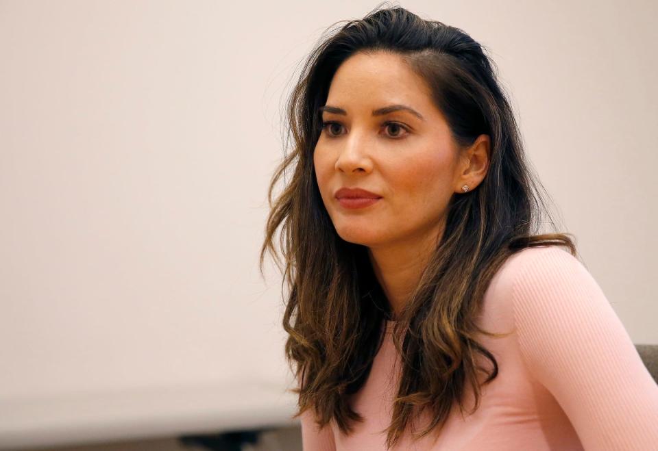 Olivia Munn talks with a reporter before the University of Oklahoma's Women’s and Gender Studies Board of Advocates Voices for Change gala in Norman, Okla., Friday, April 13, 2018.