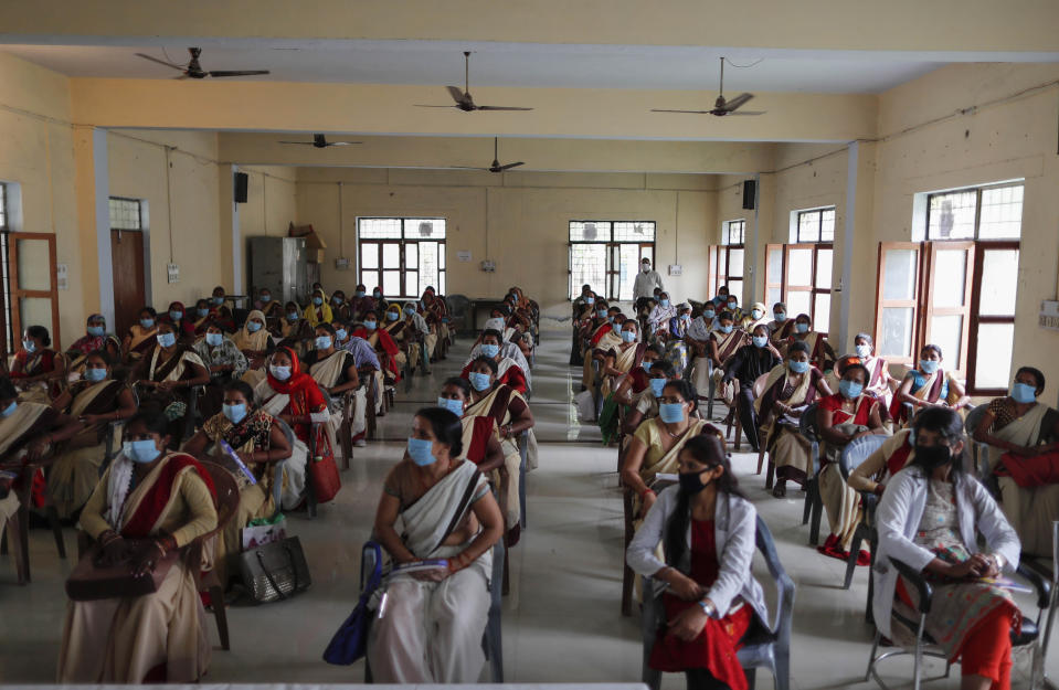 Health workers attend a training session on handling the coronavirus pandemic in villages in Fatehpur, Uttar Pradesh state, India, Wednesday, June 3, 2020. (AP Photo/Rajesh Kumar Singh)