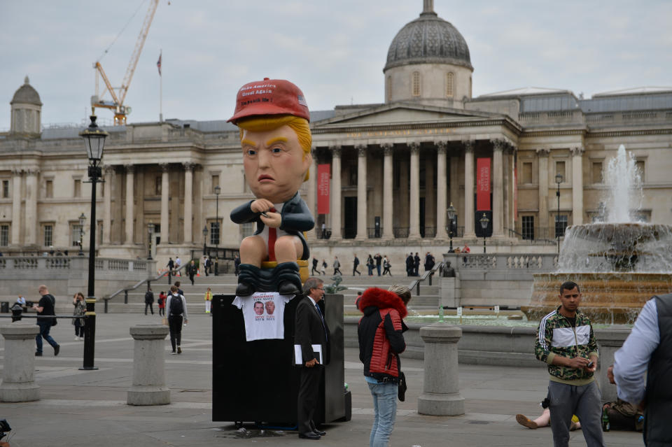 A 16ft talking robot of US President Donald Trump sitting on a gold toilet in Trafalgar Square, London on the second day of the state visit to the UK by US President Donald Trump.