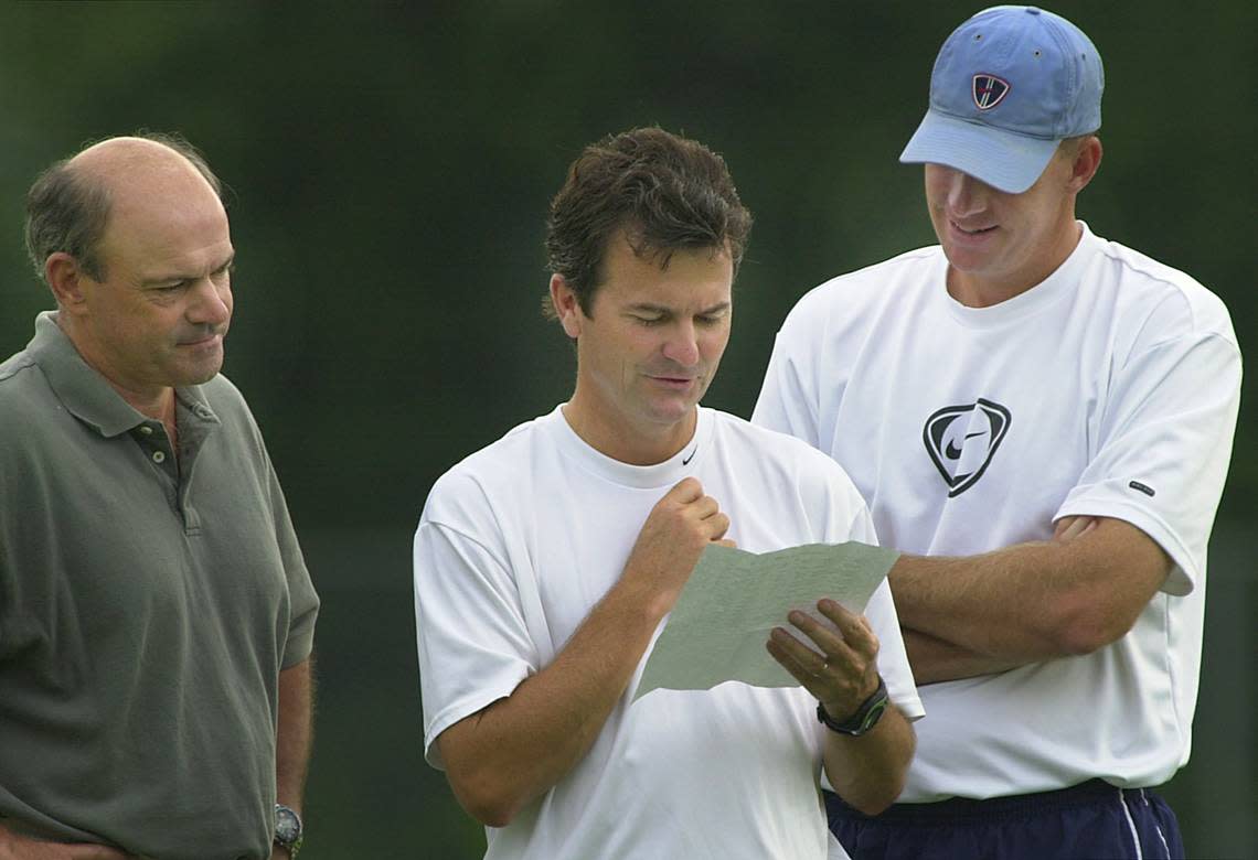 UNCWSOCCER2.SP.082001.CEL--CHAPEL HILL,NC--08/20/01--UNC women’s soccer coaches (left to right) Asst. coach: Bill Palladino, Head coach: Anson Dorrance, and goalkeeper coach: Chris Ducar look over a team roster prior to the start of practice. STAFF PHOTO:CHUCK LIDDY