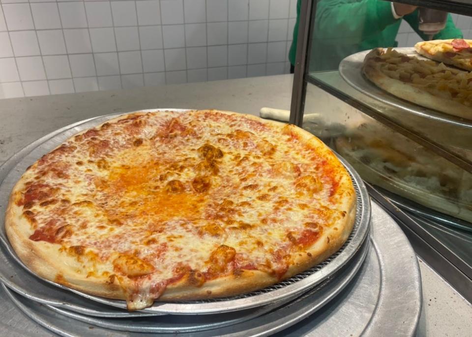 A plain pie, fresh out of the oven from 2 Bro's Pizza in New York City.