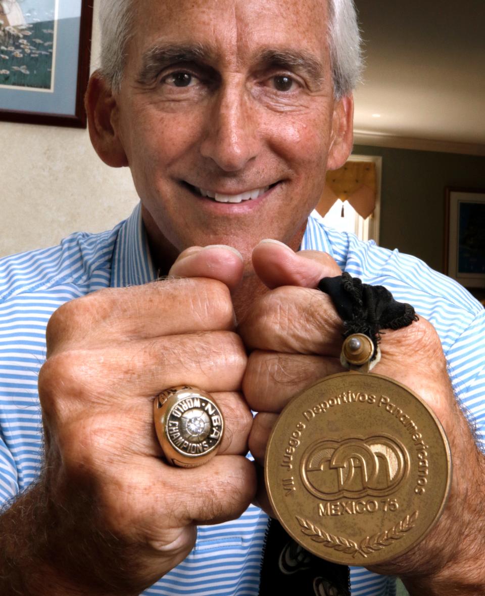 Joe Hassett with his NBA championship ring, which he won in 1979 as a member of the Seattle SuperSonics, and his 1973 Pan Am Games Gold Medal.