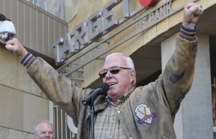 FILE - In this April 14, 2012, file photo, former Minnesota Twins manager Tom Kelly holds up hands with two World Series rings during a ceremony to unveil a statue of Twins' great Kent Hrbek prior to a baseball game against the Texas Rangers at Target Field in Minneapolis. Kelly had an offseason scare with a minor stroke, but he is well enough to return as a guest instructor at spring training where he's a valuable resource for first-time manager Paul Molitor. (AP Photo/Jim Mone, File)