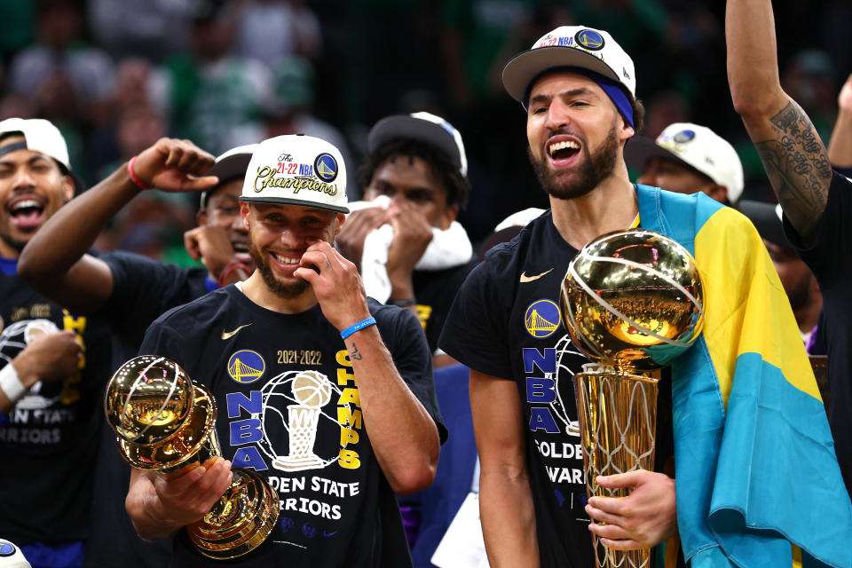 Stephen Curry and Klay Thompson of the Golden State Warriors celebrate after winning the 2022 NBA Finals. (Photo by Elsa/Getty Images)