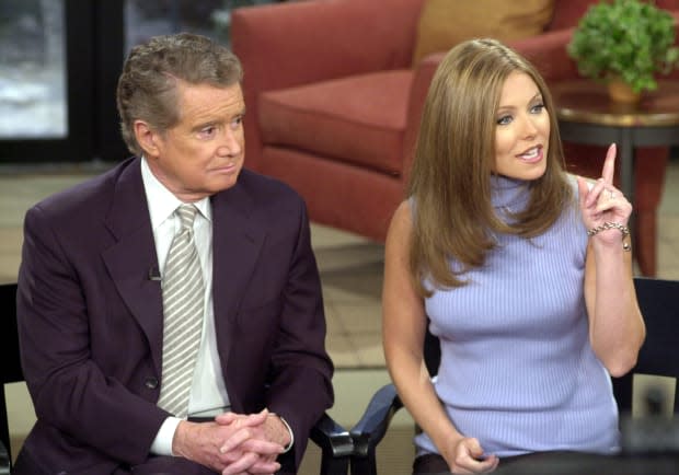 Talk show host Regis Philbin and new co-host Kelly Ripa speak to the audience during a broadcast of "Live with Regis and Kelly," February 5, 2001, in New York City. Ripa, known for her role on ABC's soap opera "All My Children," replaces Kathie Lee Gifford, who left the show in July 2000.<p><a href="https://www.gettyimages.com/detail/737854" rel="nofollow noopener" target="_blank" data-ylk="slk:Spencer Platt/Getty Images;elm:context_link;itc:0;sec:content-canvas" class="link ">Spencer Platt/Getty Images</a></p>