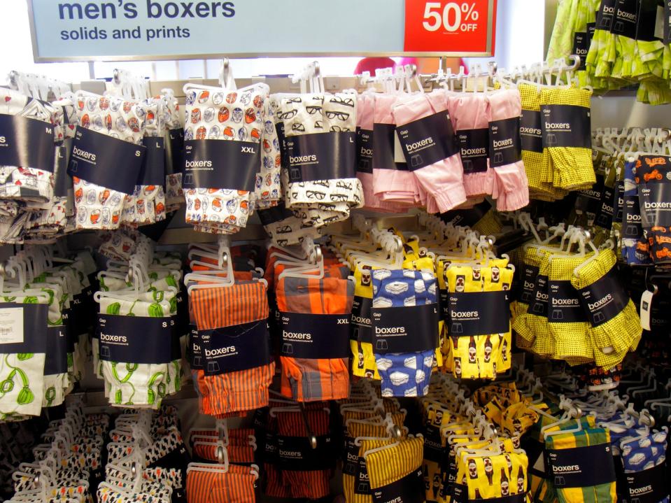 Store display shows rows of colorful men's boxers marked down 50%
