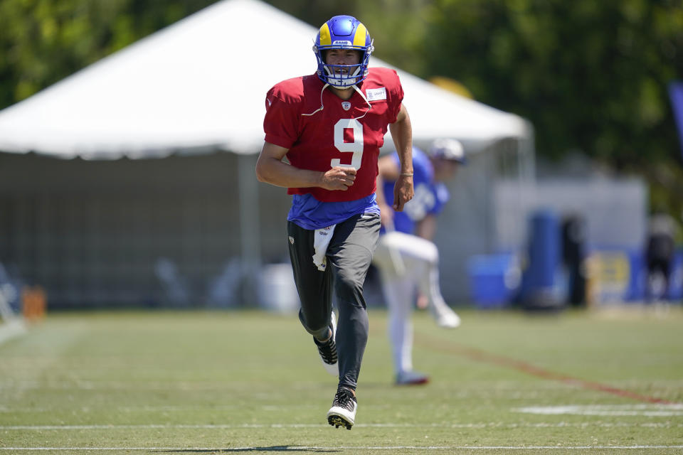 Los Angeles Rams quarterback Matthew Stafford (9) participates in drills at the NFL football team's practice facility in Irvine, Calif. Monday, Aug. 8, 2022. (AP Photo/Ashley Landis)