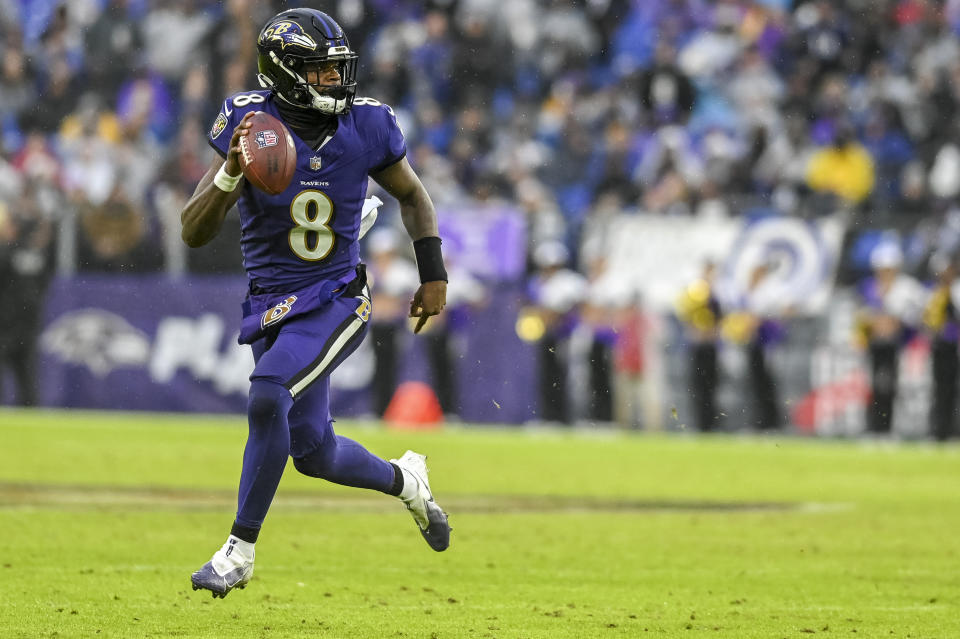 Dec 10, 2023; Baltimore, Maryland, USA; Baltimore Ravens quarterback <a class="link " href="https://sports.yahoo.com/nfl/players/31002" data-i13n="sec:content-canvas;subsec:anchor_text;elm:context_link" data-ylk="slk:Lamar Jackson;sec:content-canvas;subsec:anchor_text;elm:context_link;itc:0">Lamar Jackson</a> (8) rolls out to pass during the second half against the <a class="link " href="https://sports.yahoo.com/nfl/teams/la-rams/" data-i13n="sec:content-canvas;subsec:anchor_text;elm:context_link" data-ylk="slk:Los Angeles Rams;sec:content-canvas;subsec:anchor_text;elm:context_link;itc:0">Los Angeles Rams</a> at M&T Bank Stadium. Mandatory Credit: Tommy Gilligan-USA TODAY Sports