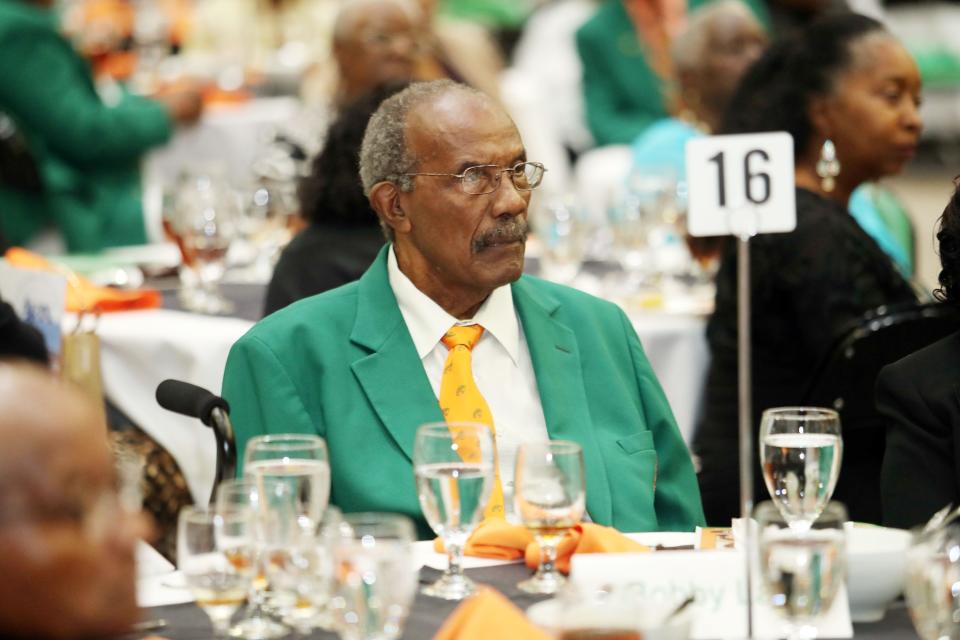 Former track head coach Bobby Lang listens to speeches during the FAMU Sports Hall of Fame banquet inside the Al Lawson Multipurpose Center.