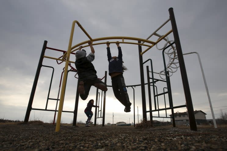 Children play in a playground in the Attawapiskat First Nation in northern Ontario. Reuters Photo.