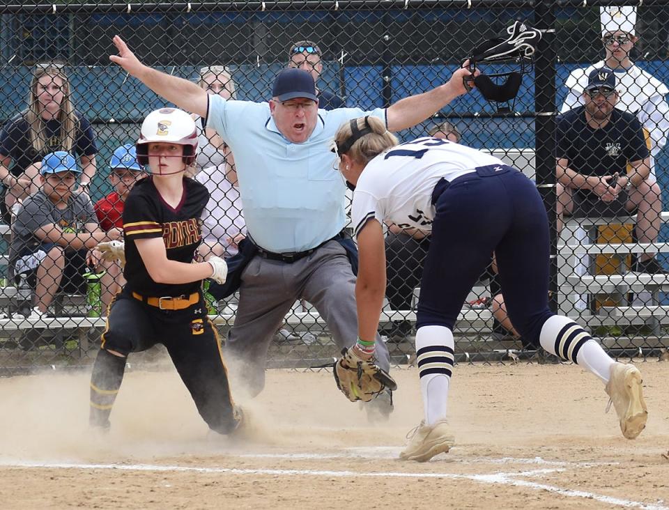 Case's Lily Picard is safe at home before the tag of Archbishop Williams pitcher Jillian Ondrick.