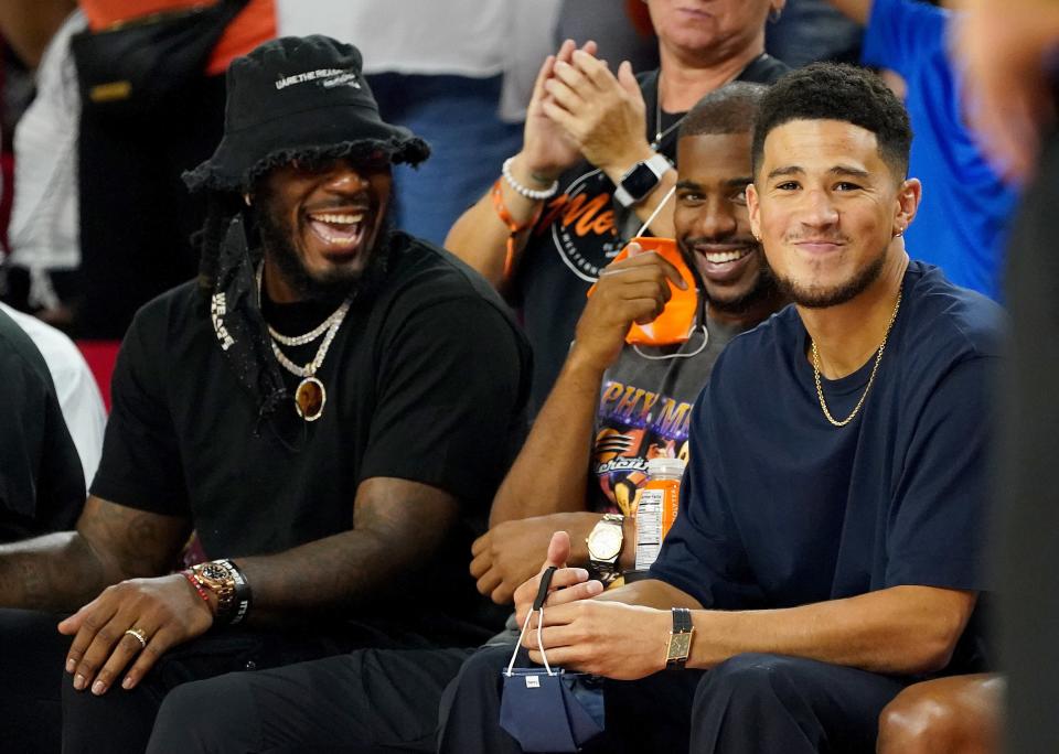 Phoenix Suns players Jae Crowder, Chris Paul have fun at Devin Booker's expense as they attend the Phoenix Mercury-Las Vegas Aces game in Tempe.
 Darryl Webb/Special for the Republic, AP
Phoenix Suns players Jae Crowder, Chris Paul share a laugh at Devin Booker's expense as they attend the Phoenix Mercury-Las Vegas Aces game at ASU Desert Financial Arena Oct, 3, 2021 in Tempe.