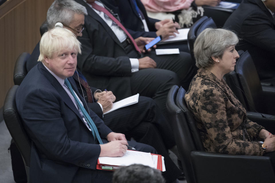 Back seat driver? Boris Johnson sits behind Theresa May at the United Nations earlier this week (AP Photo/Mary Altaffer)