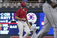 Minnesota Twins pitcher Sonny Gray waits after giving up a grand slam to Chicago White Sox's Luis Robert, rear, during the fourth inning of a baseball game Thursday, July 14, 2022, in Minneapolis. (AP Photo/Jim Mone)