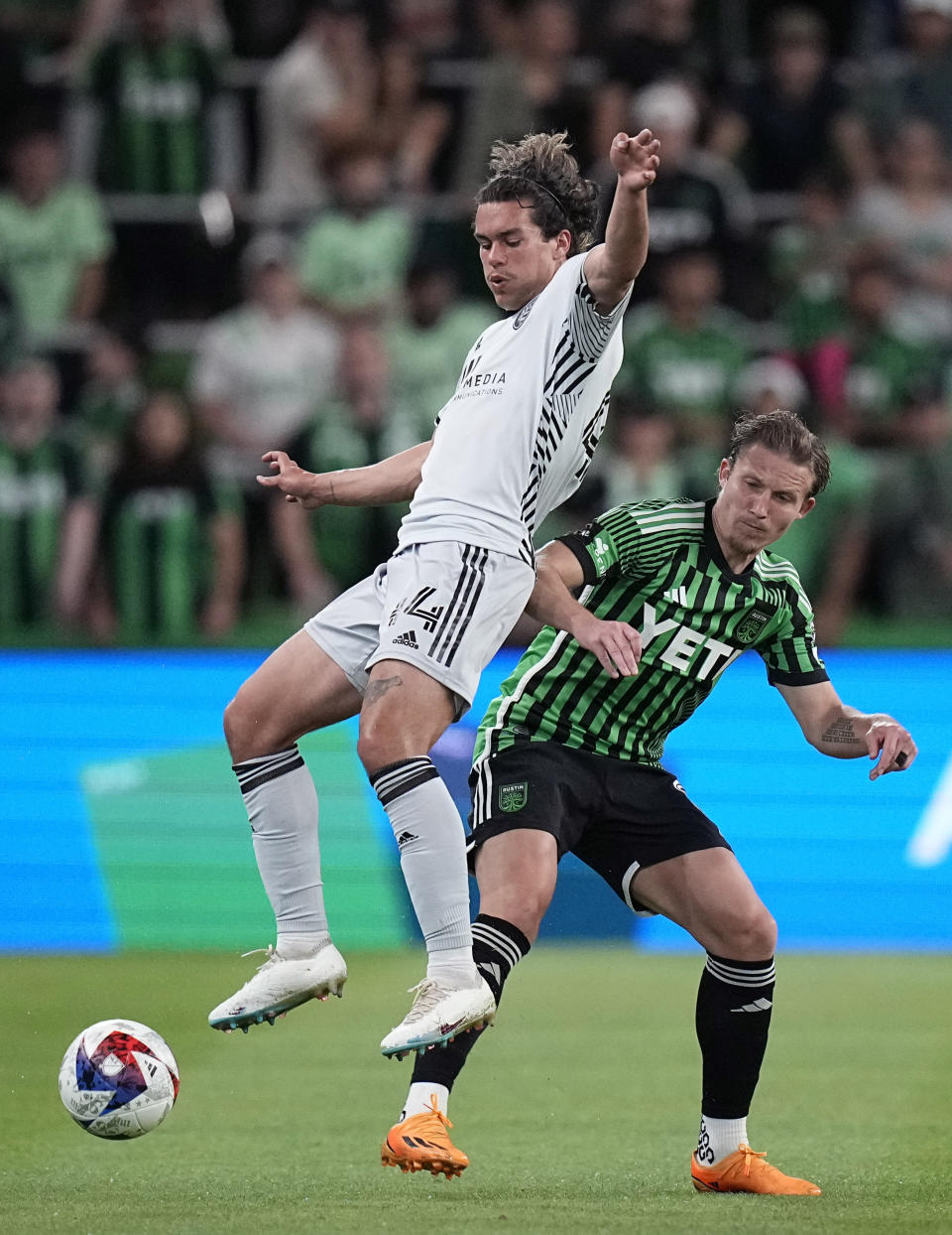 San Jose Earthquakes forward Cade Cowell (44) competes with Austin FC midfielder Alexander Ring for control of the ball during the second half of an MLS soccer match in Austin, Texas, Saturday, April 29, 2023. (AP Photo/Eric Gay)