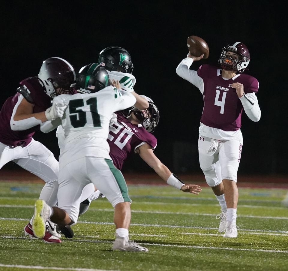 Harrison quarterback Marco Citro (4) fires a pass during the Huskies' 24-21 win over Yorktown in Class A semifinal football action at Harrison High School on Friday, November 3, 2023.