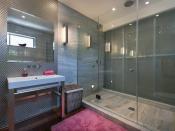 <p>Here’s one of the lavish bathrooms, with a huge glass-door shower. (Realtor.com) </p>