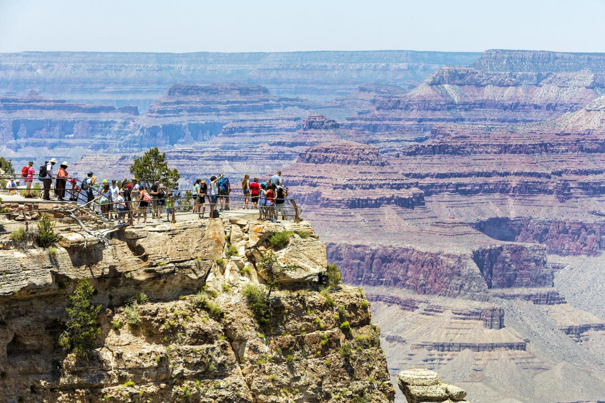 visitors enjoying views of Grand Canyon National Park, Arizona