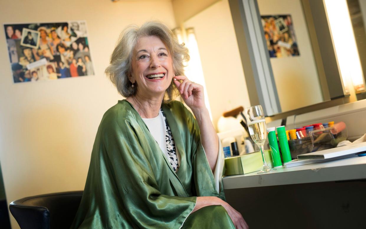 Dame Maureen Lipman backstage at the St James Theatre in 2016, in a green dressing robe and with a glass of champagne - David Rose