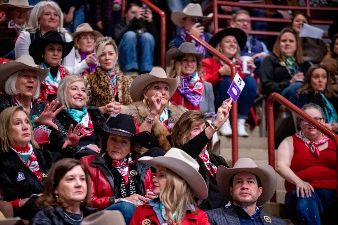 An audience member bids for the 2023 Grand Champion steer during the Fort Worth Stock Show & Rodeo’s Junior Sale of Champions on Saturday, Feb. 4, 2023. This year’s steer was sold for $440,000, beating last year’s record by $130,000.