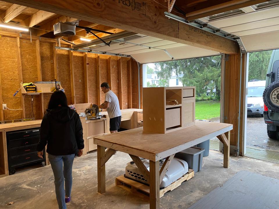 Danny and Kelley Diatchenko, co-owners of custom van and camper conversion business, VaVaVans, showing off their workspace in their home garage, located in Taunton.