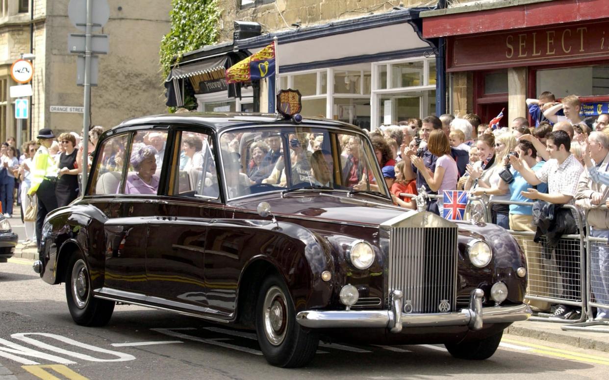 The Queen driving through Uppingham in a Rolls Royce after a walkabout in Rutland - Tim Graham Photo Library