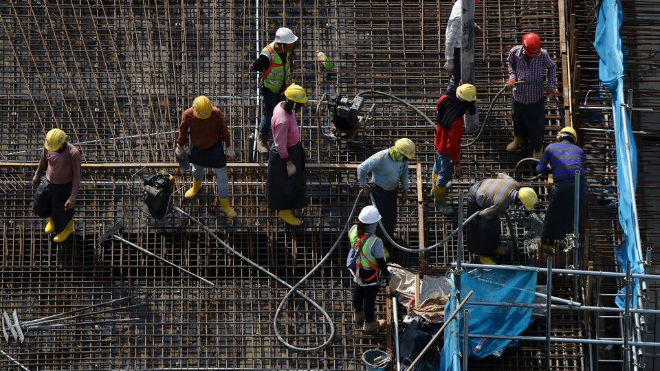 Migrant workers at a construction site in Singapore on May 3, 2023. - Suhaimi Abdullah/NurPhoto/Getty Images