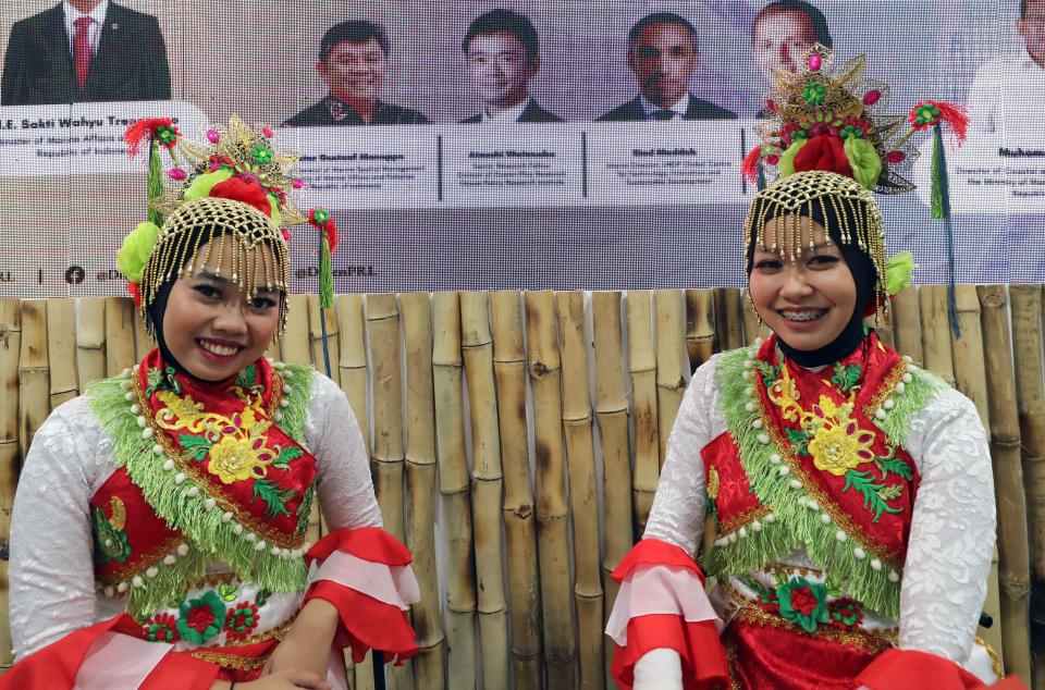 Attendees wear traditional clothing at the climate conference (EPA)