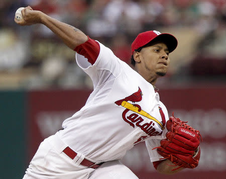 FILE PHOTO: St. Louis Cardinals starting pitcher Carlos Martinez delivers a pitch to a Los Angeles Dodgers batter during the first inning of their MLB baseball game in St. Louis, Missouri, August 8, 2013. REUTERS/Sarah Conard