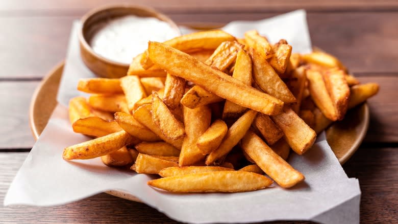 French fries on a plate with mayo