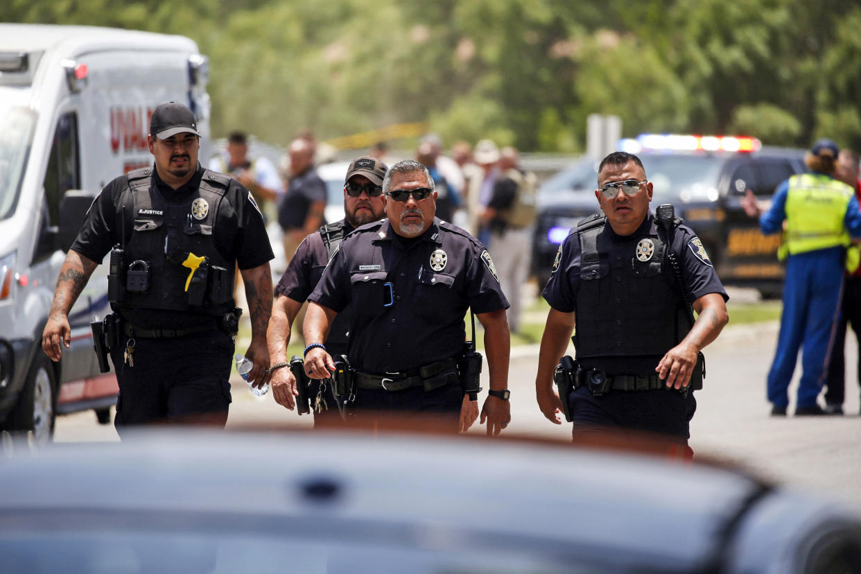 Police walk near Robb Elementary School following a shooting on May 24, 2022, in Uvalde, Texas. (Dario Lopez-Mills / AP)