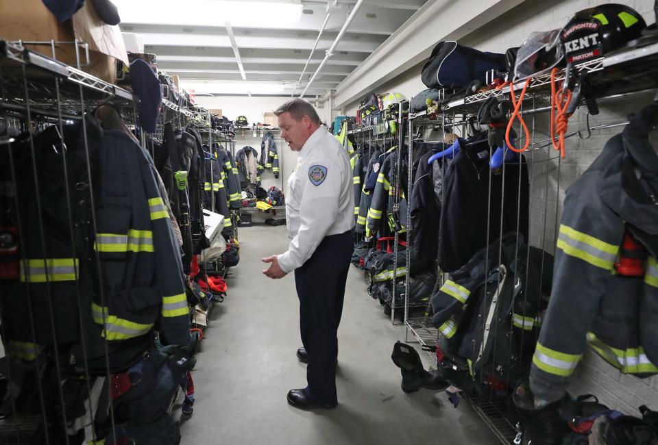 James Samels, the new Kent Fire chief, discusses the fact that his department has two sets of turnout gear for every firefighter while giving a tour of the equipment room at Station 1 in Kent on Tuesday, Feb. 27, 2024.
