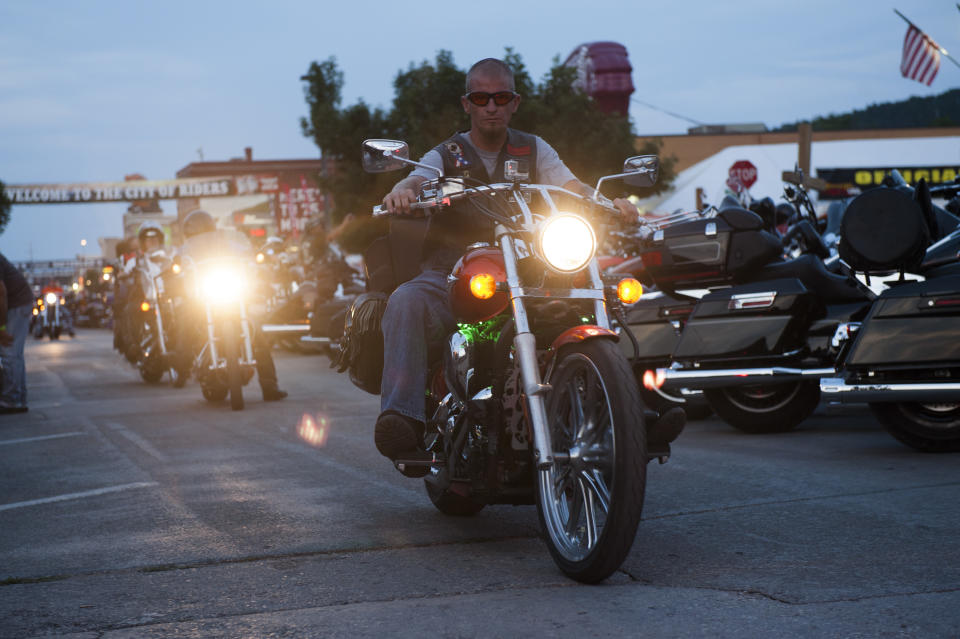 STURGIS, SD - AUGUST 3:  A biker rides downtown on the first day of the annual Sturgis Motorcycle Rally August 3, 2015 in Sturgis, South Dakota.  This year marks the 75th anniversary of the rally, with crowds of up to 1.2 million people expected to visit.    (Photo by Andrew Cullen/Getty Images)