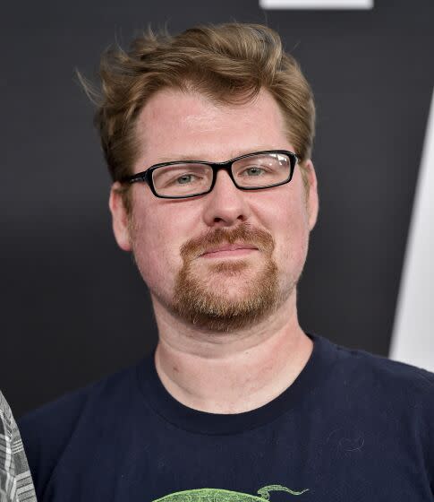 Justin Roiland wearing glasses and a t-shirt