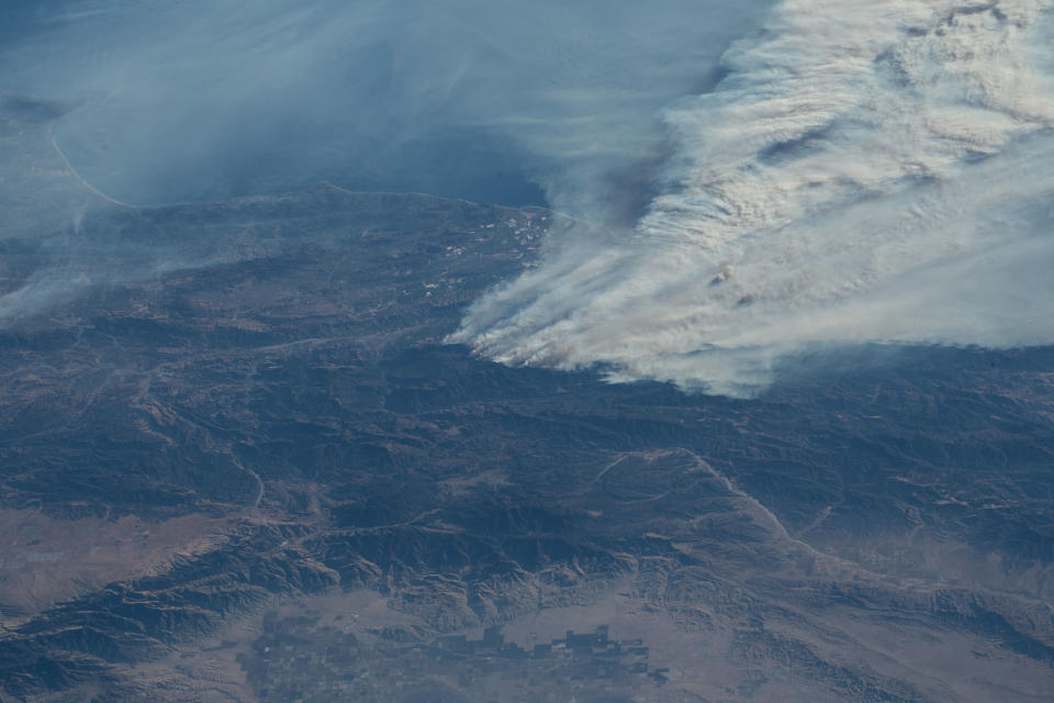 <p>Expedition 53 Commander Randy Bresnik aboard the International Space Station took this photo of the California wildfires in the Los Angeles on Dec. 6, 2017. (Photo: NASA) </p>