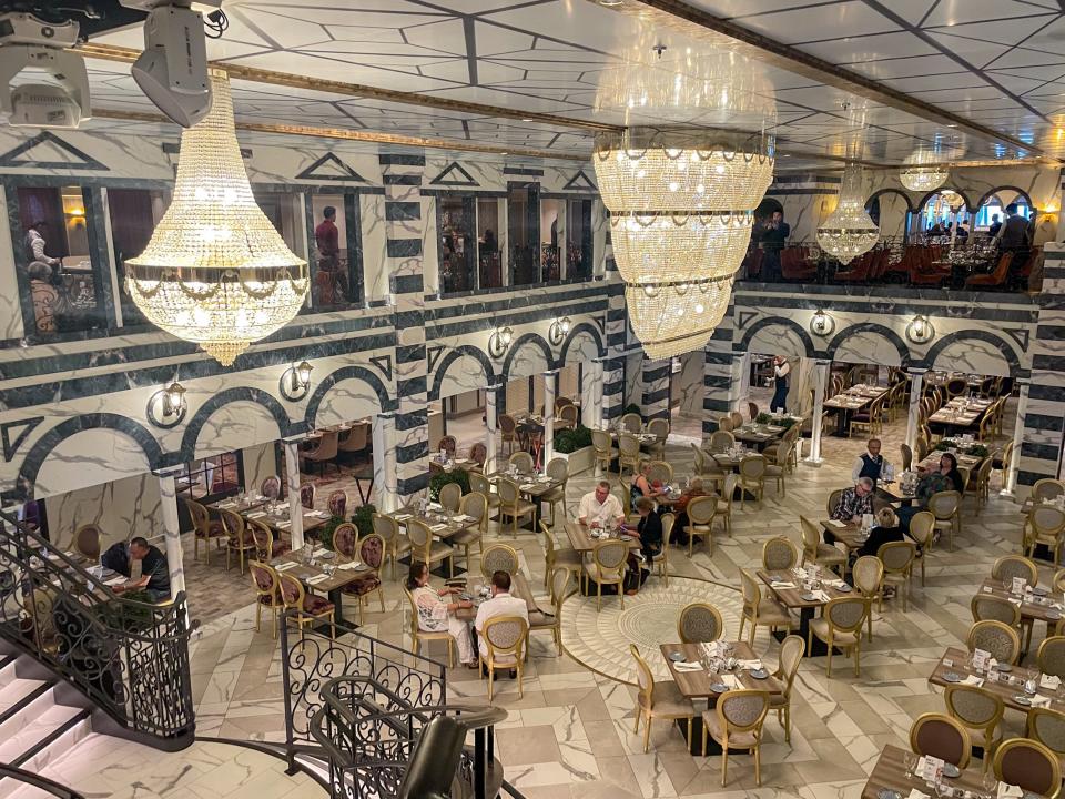 people in a large dining room on Carnival Firenze