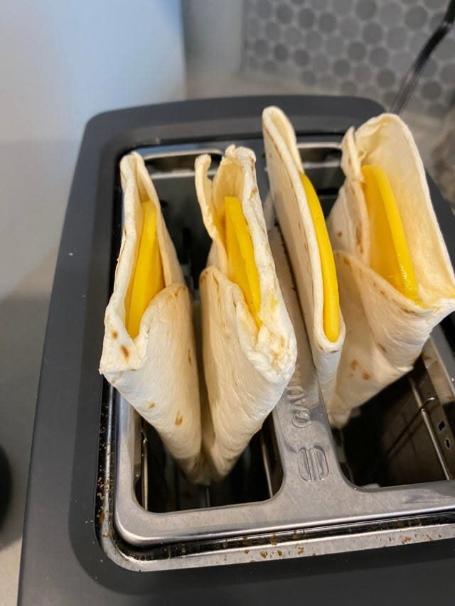 Two cheese quesadillas folded in the toaster oven.