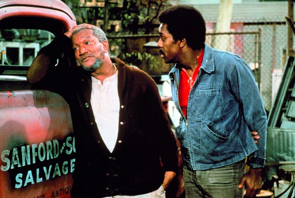 Redd Foxx, left, stars as Fred G. Sanford, a widower and junk dealer in the Watts neighborhood of Los Angeles, and Demond Wilson as his son Lamont, in "Sanford and Son."
