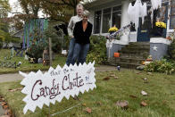 Carol McCarthy and her husband, Tom, pose for a portrait at their home they decorated for Halloween, Monday, Oct. 26, 2020, in Palmyra, N.J. (AP Photo/Michael Perez)