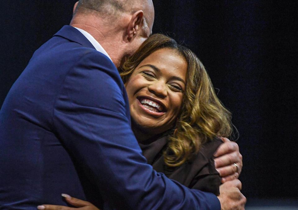 Student Briana Bowen, right, smiles as she accepts a Martin Luther King Jr Award For Excellence in Service to For Outstanding Commitment to Inclusive Excellence and Service to Your Community from President Jim Clements during the 41st annual Dr. Martin Luther King Jr. Commemorative Keynote Program at the Brooks Center for the Performing Arts at Clemson University Tuesday, January 16, 2023. Keynote speaker, Yolanda Renee King, is the sole grandchild of Dr. Martin Luther King, Jr. and Coretta Scott King. 