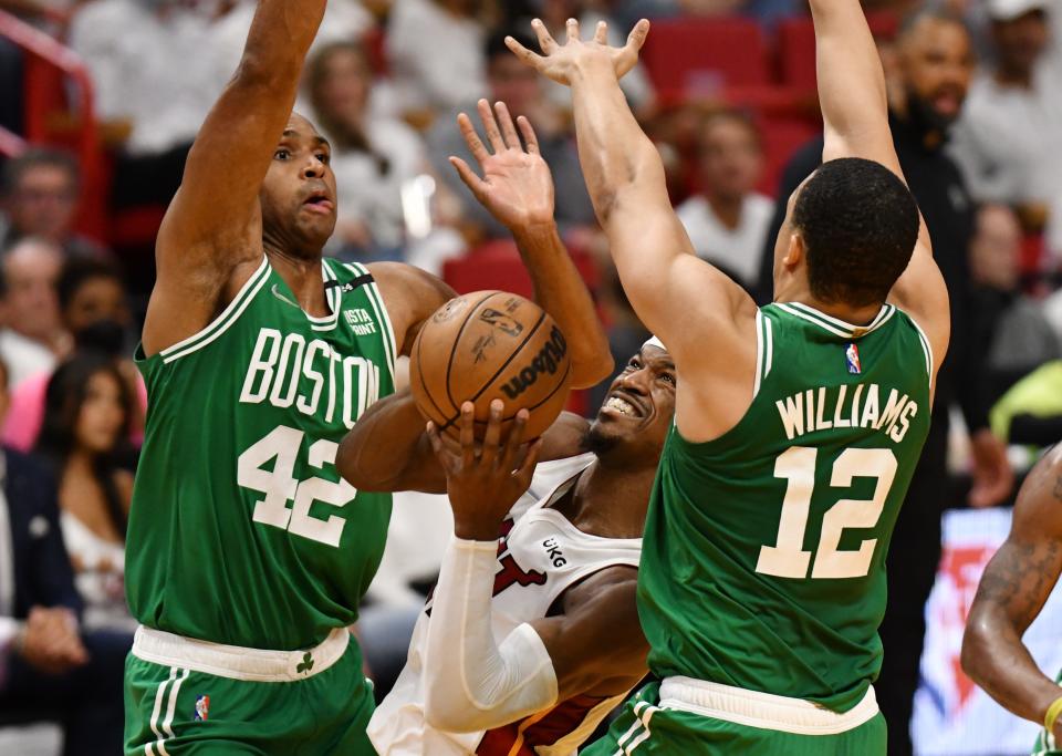 East finals: Heat forward Jimmy Butler (22) tries to find space to get to the basket between Celtics defenders Al Horford (42) and Grant Williams (12) during the first half of Game 2.